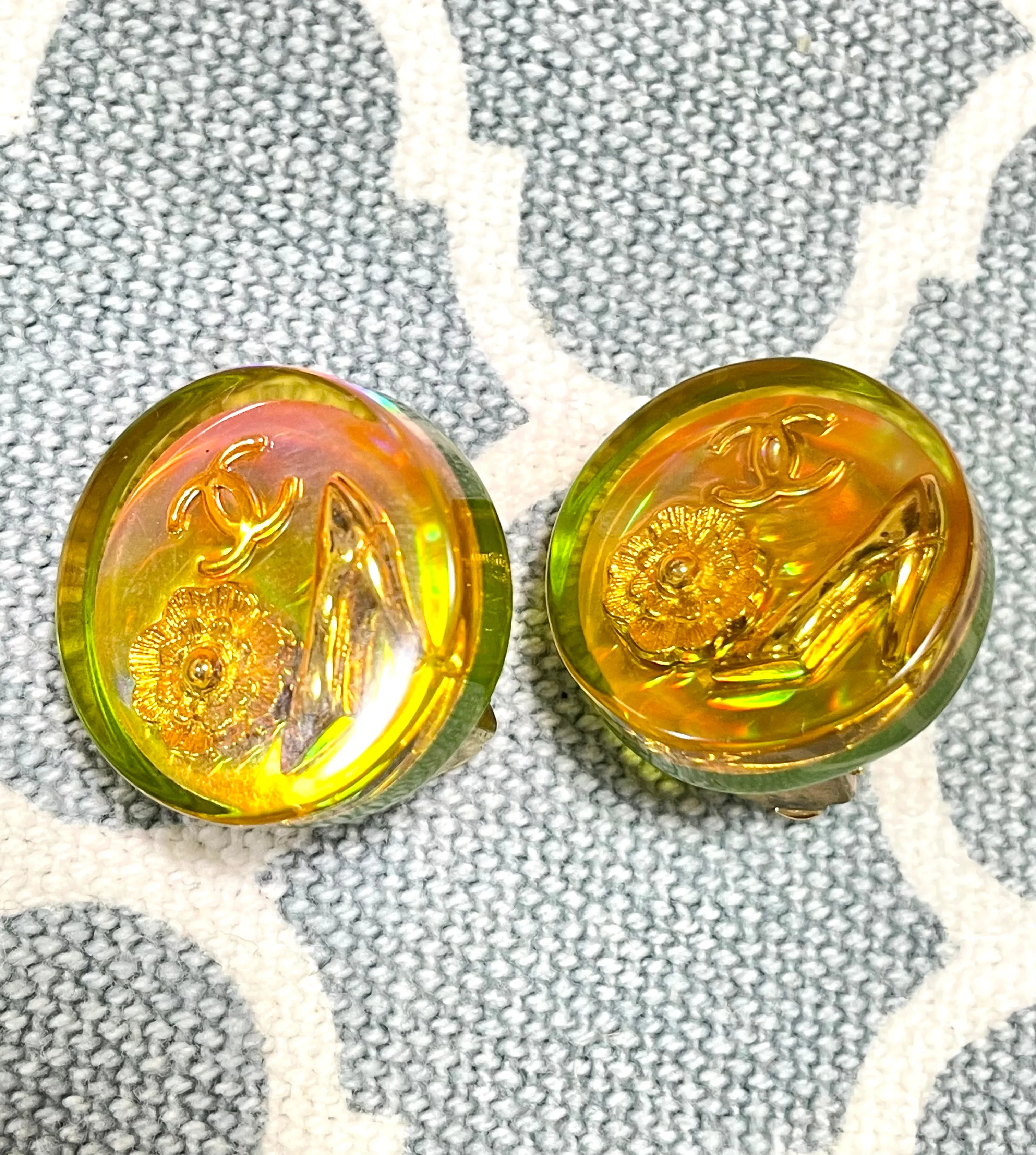 Vintage CHANEL yellow orange tone aurora resin earrings with Chanel iconic charms. Golden shoe, camellia, and CC mark in it. 041228an1