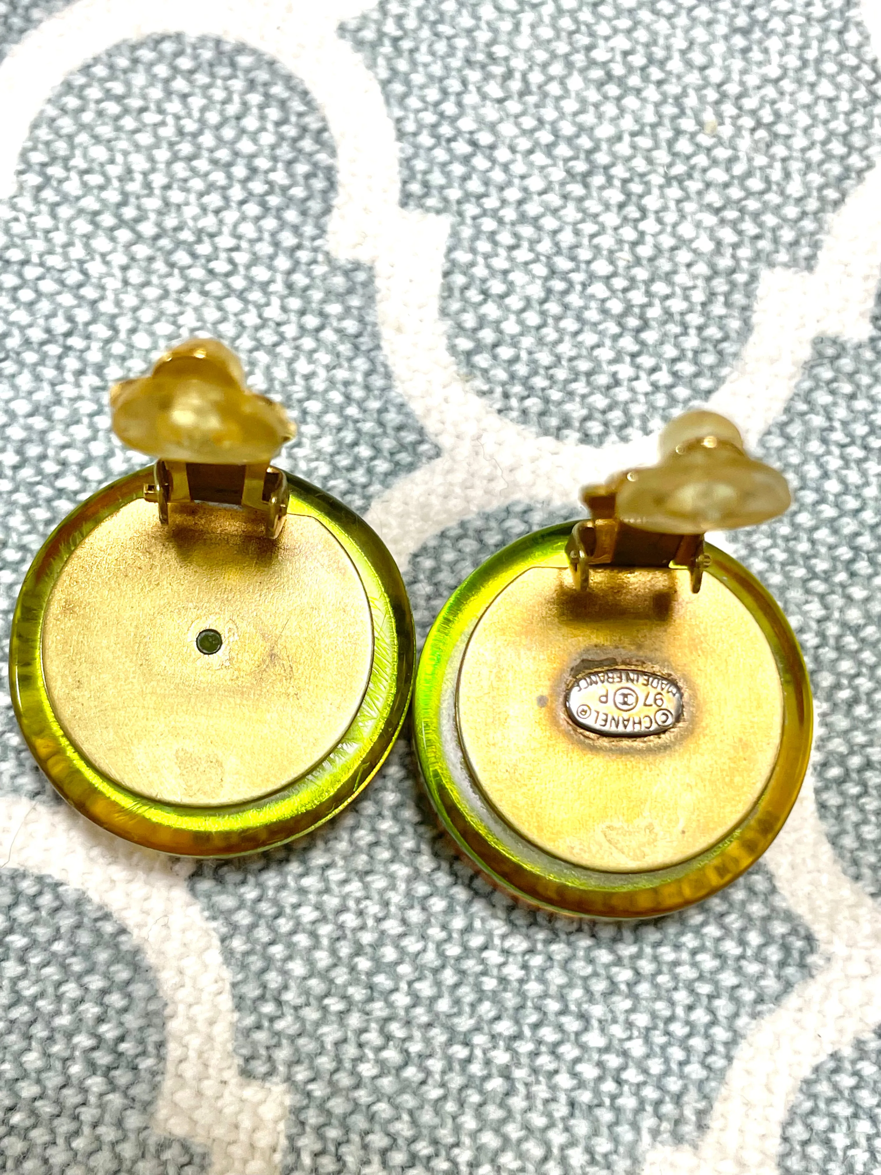 Vintage CHANEL yellow orange tone aurora resin earrings with Chanel iconic charms. Golden shoe, camellia, and CC mark in it. 041228an1