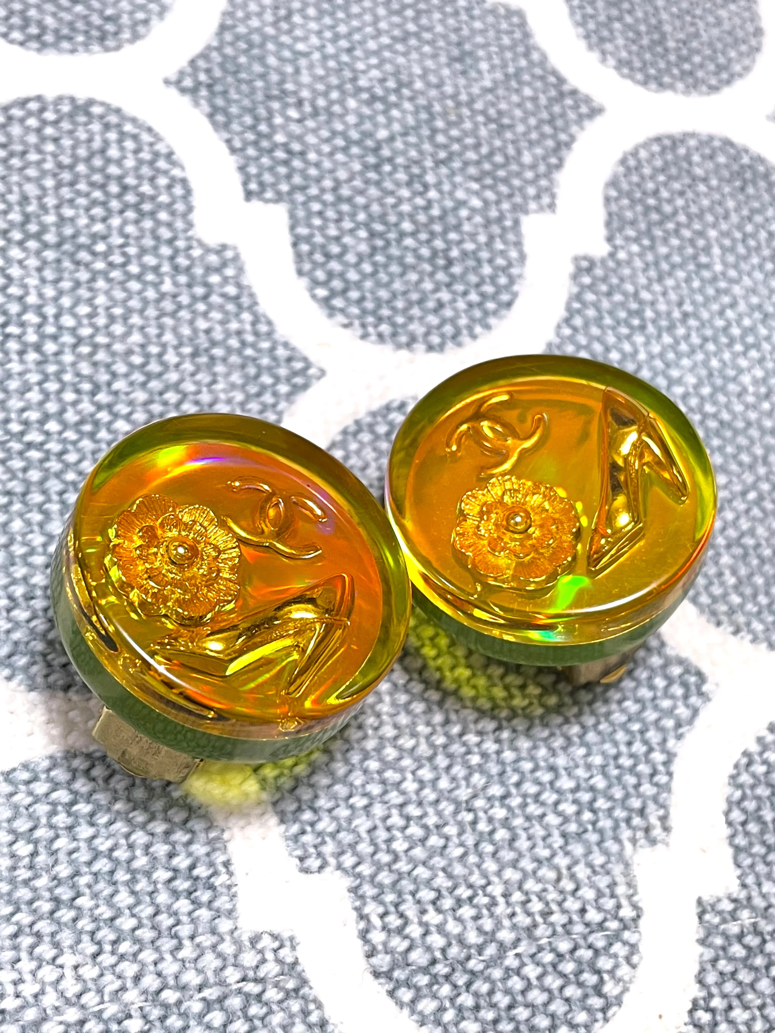 Vintage CHANEL yellow orange tone aurora resin earrings with Chanel iconic charms. Golden shoe, camellia, and CC mark in it. 041228an1